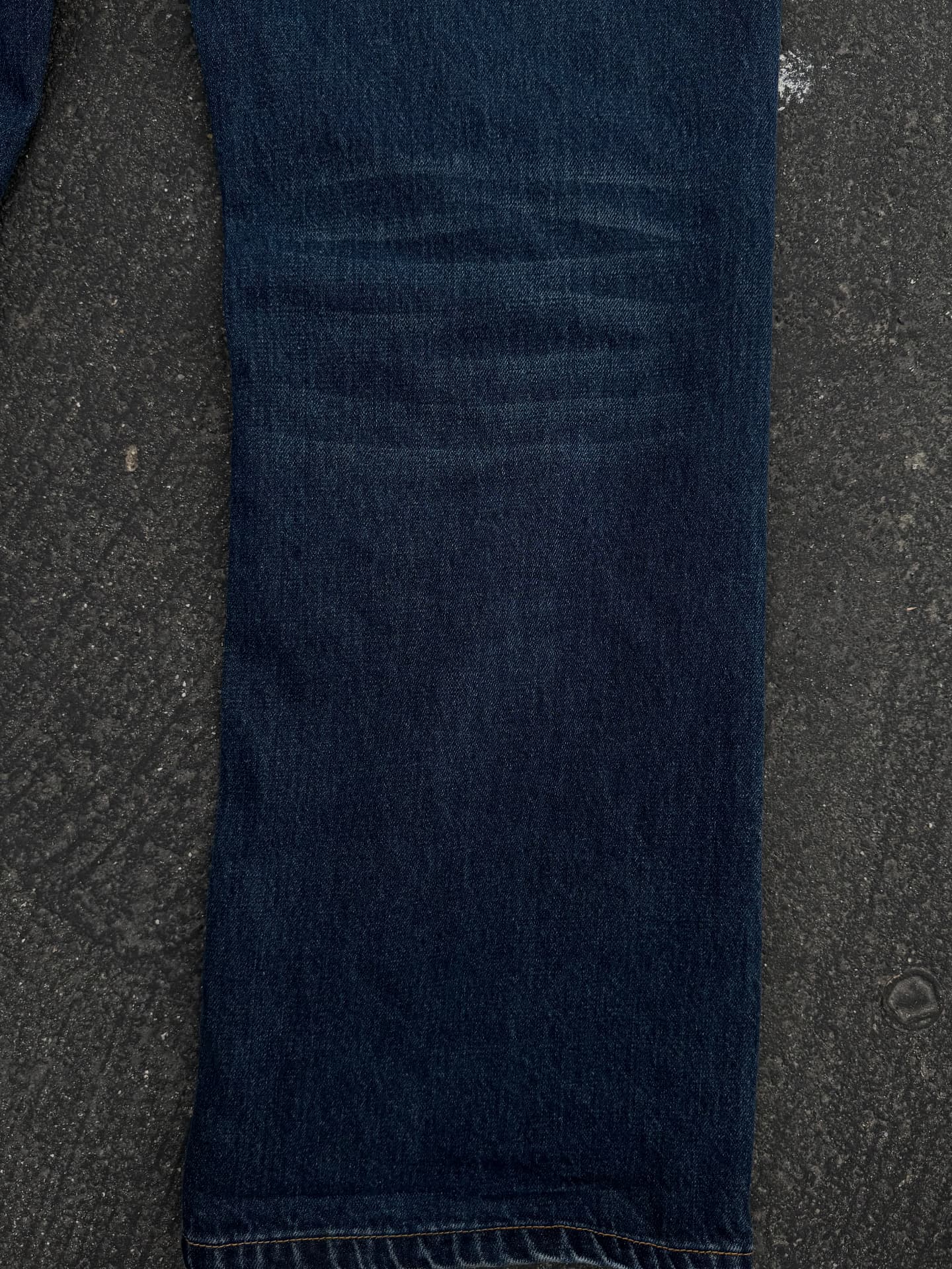 Close detail of washed indigo denim leg